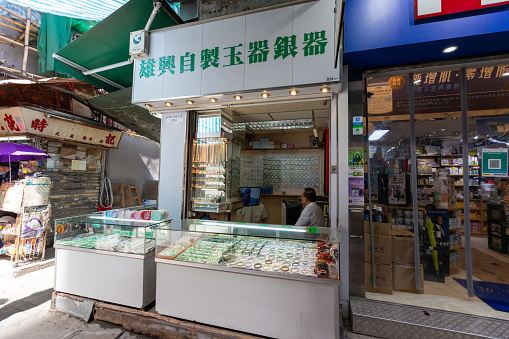 Hong Kong - August 12, 2021 : Vendor at the Jade Jewelry Shop in Yuen Long, New Territories, Hong Kong.