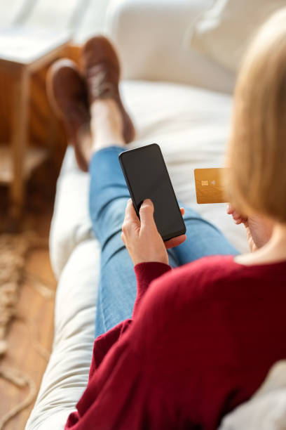 istock Woman verifying purchase in mobile app 1333762770