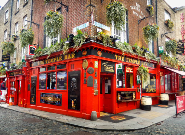 Exterior of The Temple Bar pub in Dublin Dublin, Ireland - February 2018: Exterior front view of The Temple Bar, a famous pub in the city centre temple bar pub stock pictures, royalty-free photos & images