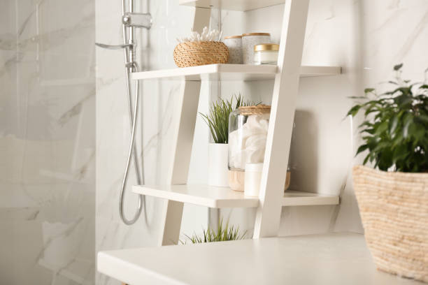 Shelving unit with toiletries in bathroom interior Shelving unit with toiletries in bathroom interior white units stock pictures, royalty-free photos & images