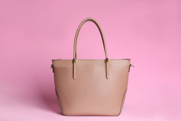 istock Stylish woman's bag on light pink background 1333768262