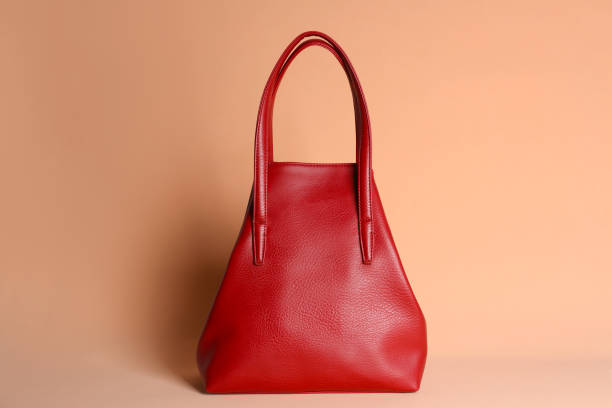 istock Red stylish woman's bag on pale pink background 1333768824
