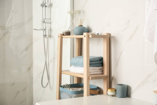 istock Shelving unit with clean towels in bathroom interior 1333769452