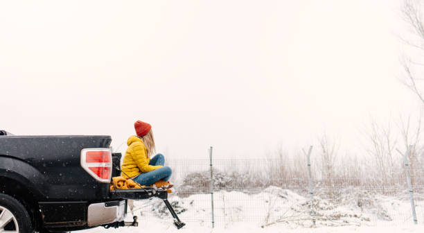 istock Young woman on a winter road trip 1333775351