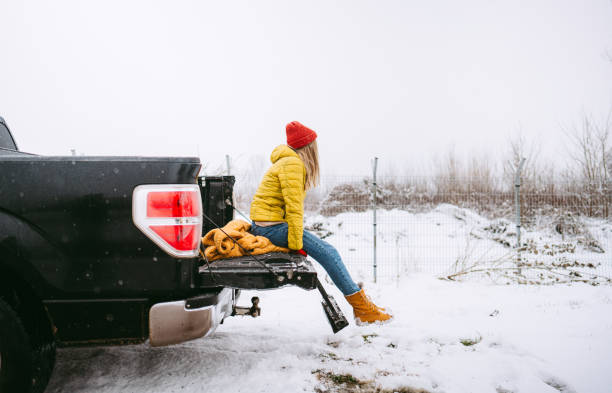 istock Young woman on a winter road trip 1333775361