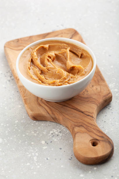 istock kitchen utensils on modern simple counter, kitchenware jars with dry ingredients bowls 1333775468