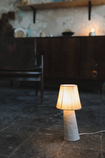 istock Stylish burning night lamp on table indoors. Light electric for interior home. 1333775673
