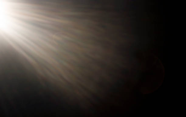 istock Sunbeams from the left on a black background 1333776477