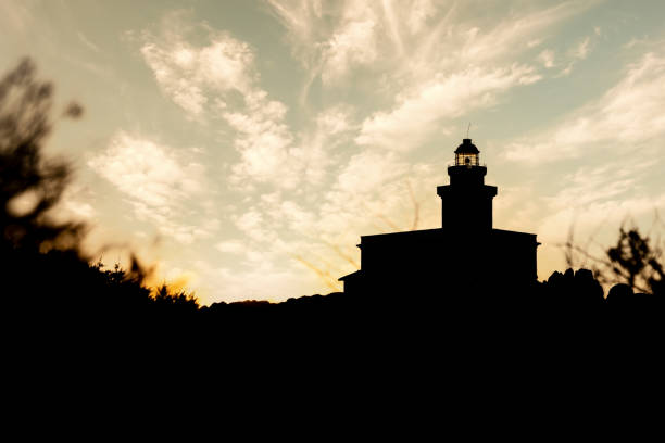 istock Silhouette view of lighthouse in Capo Testa at sunset - Sardinia 1333776940