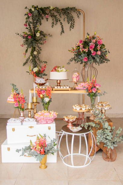 istock Wedding Setup. Cake table with sweet, decoration and flowers 1333777342