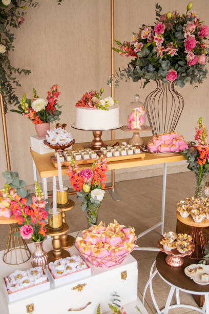istock Wedding Setup. Cake table with sweet, decoration and flowers 1333777392