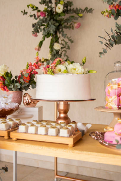 istock Wedding Setup. Cake table with sweet, decoration and flowers 1333777408