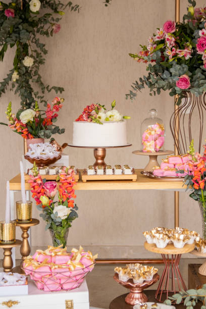 istock Wedding Setup. Cake table with sweet, decoration and flowers 1333777455