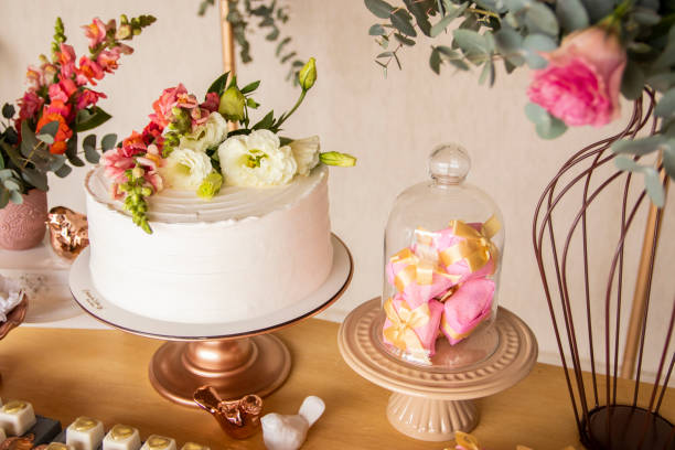 istock Wedding Setup. Cake table with sweet, decoration and flowers 1333777471
