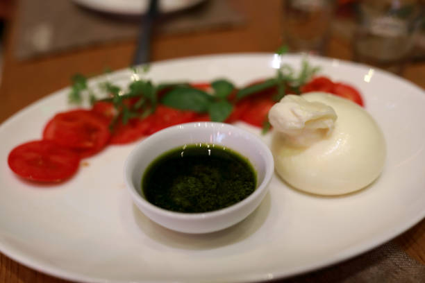 istock Burrata cheese with tomatoes and sauce 1333780713