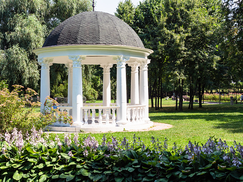 Moscow, Russia - 11 July 2021: rotunda in Ekaterinsky park in Moscow city on sunny summer day. Park has the status of natural city complex and monument of gardening art