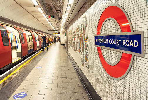 London, UK - Passengers boarding a London Underground train at Tottenham Court Road station.