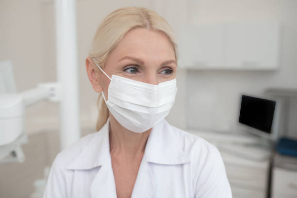 istock A blonde female doctor wearing a protective mask 1333784776