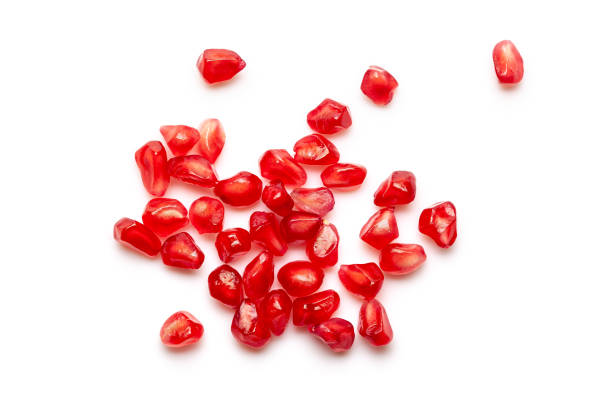 istock Micro Close-up of organic red pomegranate seed (Punica granatum) isolated over white background. 1333788086
