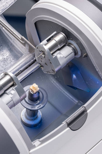 istock CAD CAM dental computer-aided machine. Digital modern dental laboratory for prosthesis and crowns milling 1333788251
