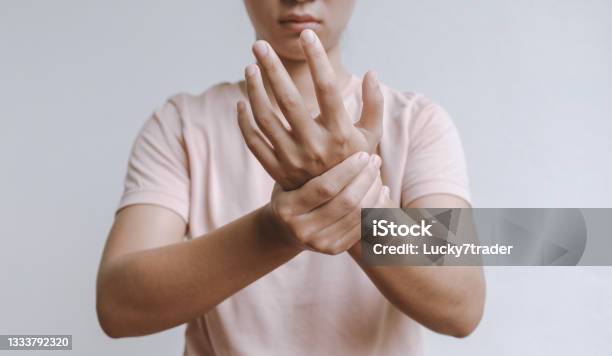 Woman Hand Massage Physiotherapy Other Side Is Sore And Numb Exhausted Tingling Guillainbarre Syndrome A Side Effect Of The Covid19 Vaccination Stock Photo - Download Image Now