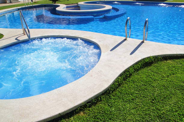 istock blue jet spa pool in green grass garden 1333794456