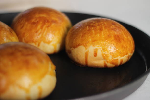 Glazing gone wrong while baking Brioche buns, a French yeast bread enriched with milk, butter and eggs.