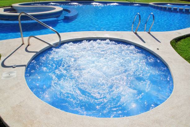 istock blue jet spa pool in green grass garden 1333794478