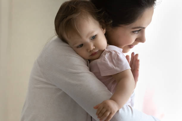 istock Loving young mom lull cuddle baby daughter 1333794830