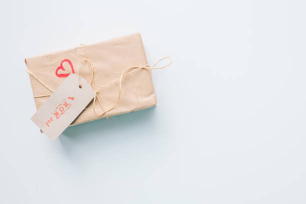 istock present gift box wrapped with craft paper and ribbon 1333799924