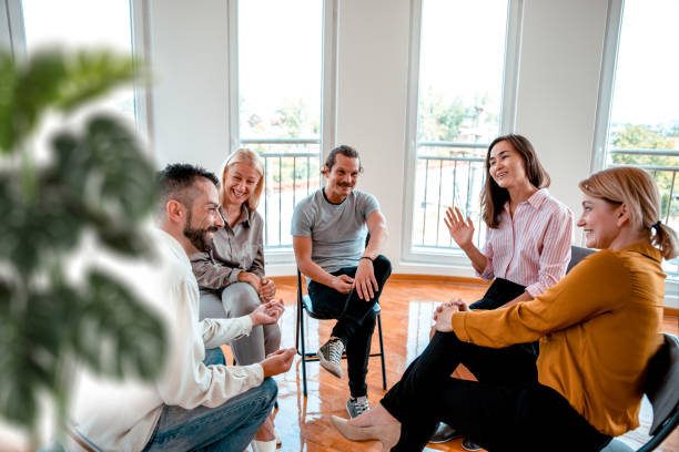 Effectively Invitie Conversation in Group Therapy Comfortable discussion diverse people on group therapy in rehabilitation centre group therapy photos stock pictures, royalty-free photos & images