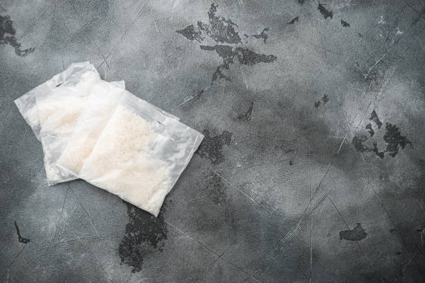 istock Quick cooking rice bag, on gray stone table background, top view flat lay, with copy space for text 1333803066
