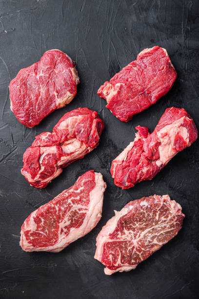 istock Raw beef steak cuts with top blade, chuck roll and rump steak, top view. 1333803201