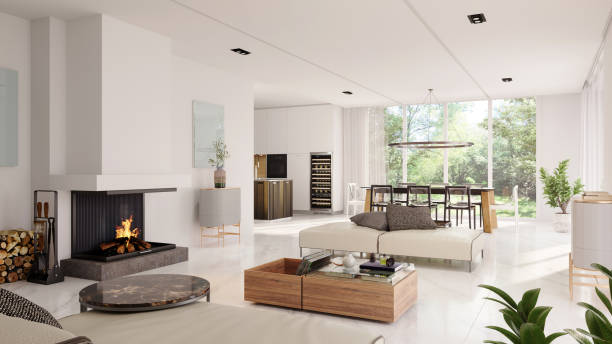 modern white interior design with fireplace and beautiful backyard view - huis stockfoto's en -beelden