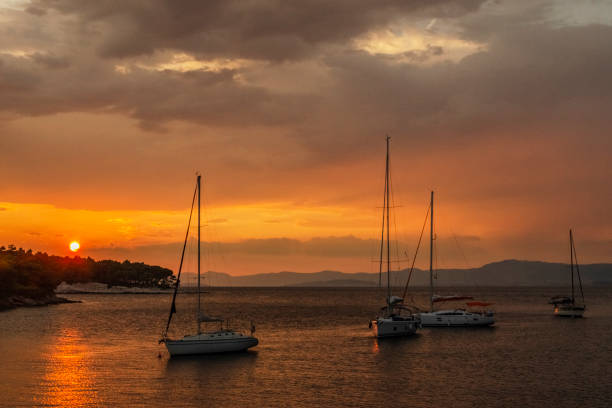 istock Dramatic rainy clouds during sunset over bay in Splitska on Brac island in Croatia. 1333804989