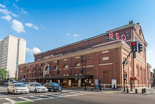 Boston, MA, USA - August 6, 2021: View of the Symphony Hall building, of the Boston Symphony Orchestra, which opened its doors in 1900. The Boston Symphony Orchestra is the second oldest orchestra in the United States of America. The hall was designated a U.S. National Historic Landmark in 1999