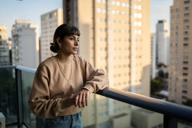 istock Young woman contemplating at home 1333805176