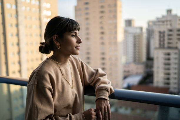 istock Young woman contemplating at home 1333805217