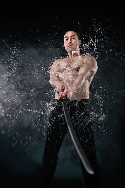 istock Martial artist stretches sword to camera. 1333806173