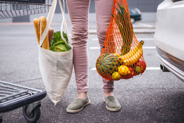 istock Reusable textile shopping bag and mesh bag with groceries purchased 1333806249