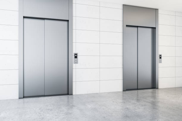 istock Modern office lobby interior with steel elevators, concrete flooring and tile wall. 3D Rendering. 1333809565