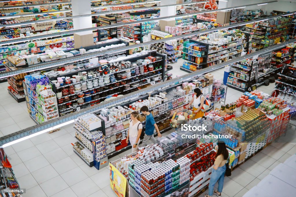 Overhead image of people buying in the large supermarket Overhead image of people buying in the large supermarket. Supermarket Stock Photo