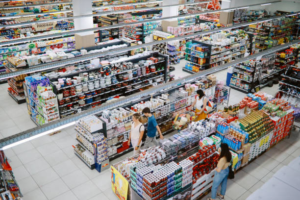 Overhead image of people buying in the large supermarket stock photo