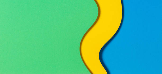 istock Abstract color papers geometry flat lay composition banner background with blue, yellow and green color tones 1333810620