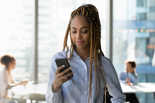 istock Young african ethnicity businesswoman using cellphone applications. 1333810629