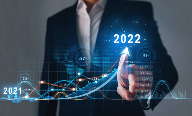 Businessman draws  increase arrow graph corporate future growth year 2021 to 2022.   Development to success and motivation. Businessman draws  increase arrow graph corporate future growth year 2021 to 2022.   Development to success and motivation 2022 stock pictures, royalty-free photos & images