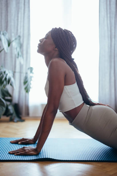 istock Young Woman Practicing Yoga in the Morning 1333812771