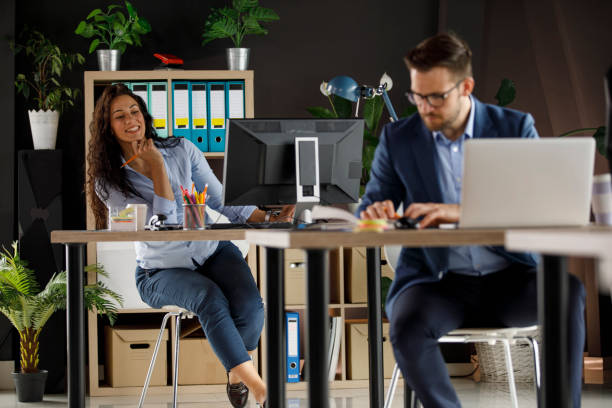 istock Looking at what her coworker, sitting in front, is doing 1333813289