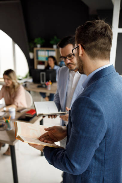 istock Two businessmen planning further projects at the office 1333813293