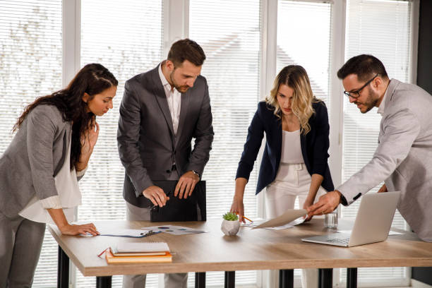 istock Group of business people reviewing documents during a meeting 1333814007